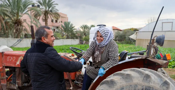 a woman shaking hands with a man