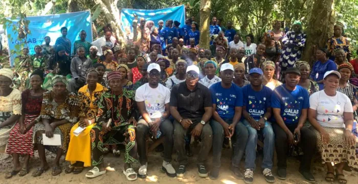 Community Beneficiaries sit together with some ILO staff and stakeholders for a photo