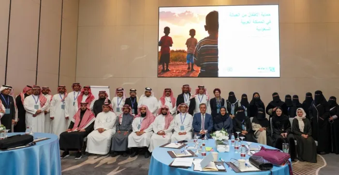 a group photo of ILO representatives with their partners and trainees