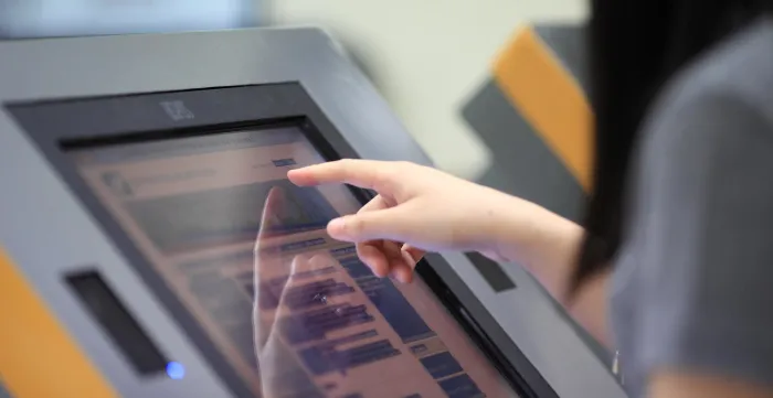 use of touch-screen computer to register and access information