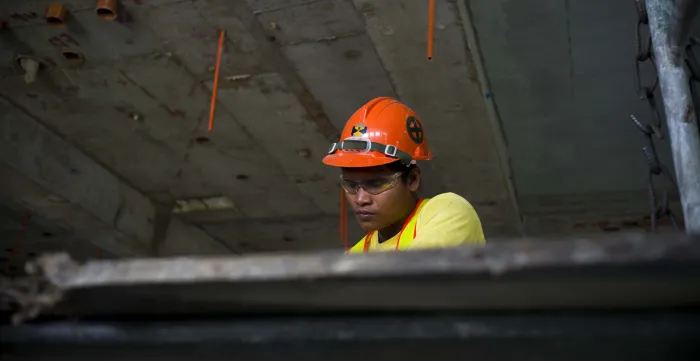 construction worker in yellow shirt and hard hat