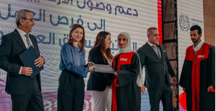 A female student receives her diploma
