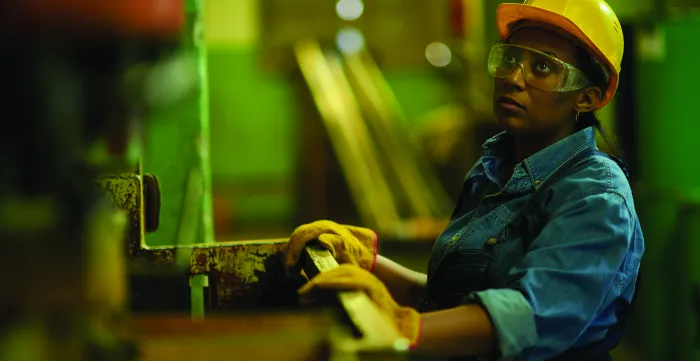 Young woman working at a construction site in Sri Lanka.May 19, 2015