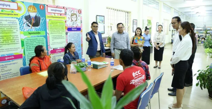People standing and sitting in an exhibition area