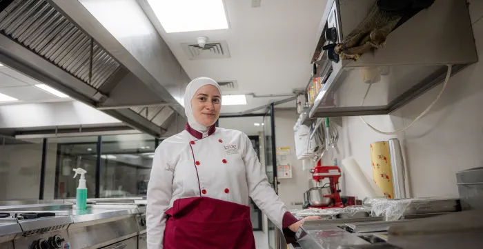 Culinary student Sara Al-Tamimi during her work-based learning placement in a restaurant kitchen. Amman, Jordan, September 15, 2025. 