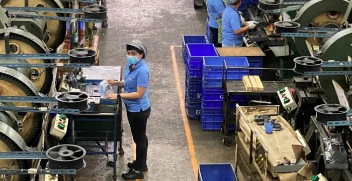 A worker in a Thai company producing components for the automotive industry 