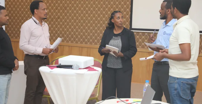 Participants actively interacting in a role play.