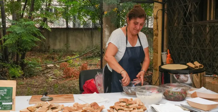 Cooperative member preparing catering for participants during the signing ceremony of the MOU between the ILO and GDC. Beirut, Lebanon- 22/9/2026