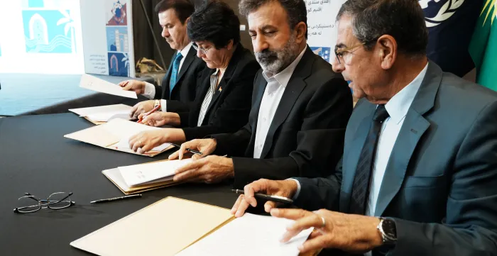 Kwestan Mohamad Abdulla Maarouf, Minister of Labour & Social Affairs of the Kurdistan Regional Government, and representatives of workers’ and employers’ organizations sign the Founding Document of the Tripartite Social Dialogue Forum. Erbil, Iraq. 1/9/26