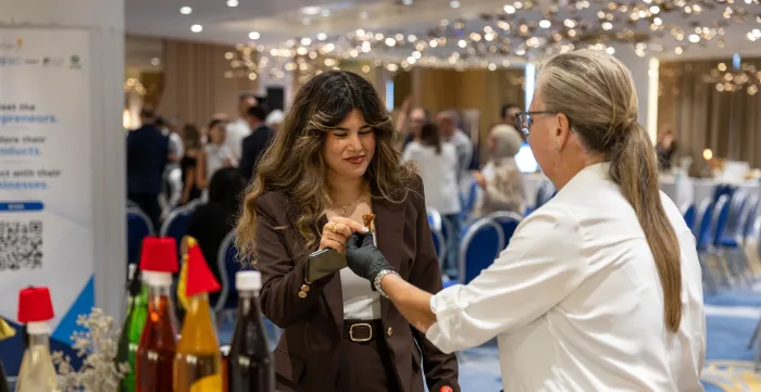 Visitors of the ENABLE entrepreneurship event, engage with a participating entrepreneur and explore locally produced items showcased during the exhibition. Beirut, Lebanon 22 September 2026