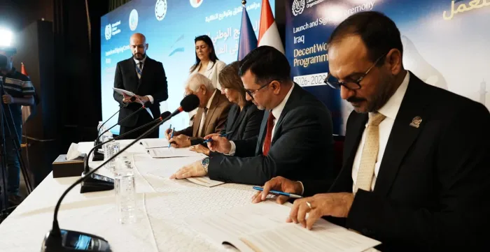Representatives of the Government of Iraq, the Conference of Trade Union Federations and Unions in Iraq, the Iraqi Federation of Industries and the ILO sign Iraq’s new Decent Work Country Programme.