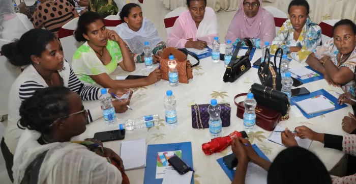 Participants engaging in a group work to develop action plans