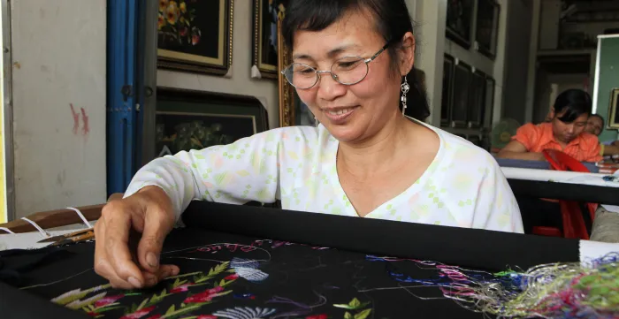 A woman at work during an embroidery workshop