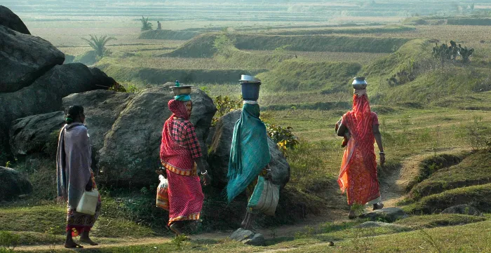 Informal economy workers carrying lunch, India