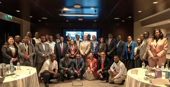 Group photo of participants at a regional labour migration meeting