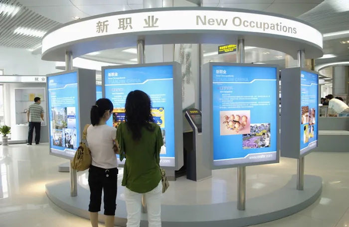 women looking at board