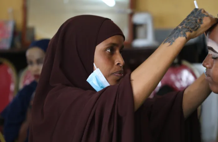 woman practicing make up 