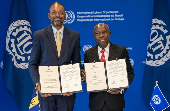 Mr. Colin E. Jordan, the Minister of Labour, Social Security and Third Sector of Barbados, presents the instruments of ratification of Convention No. 155, its Protocol and Convention No. 187 to the ILO Director-General, Gilbert F. Houngbo. 5 June 2025.