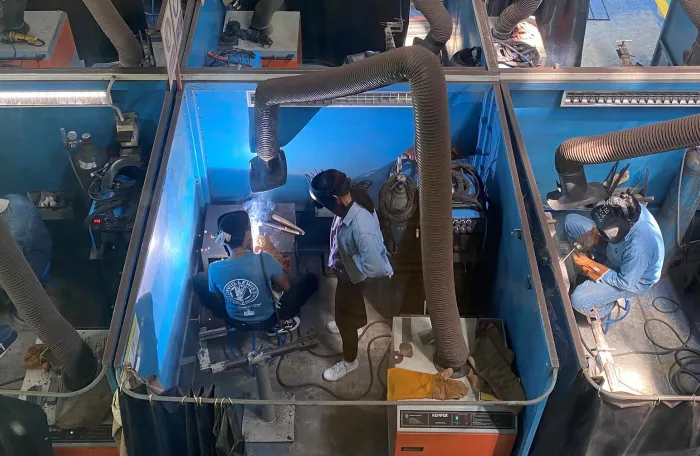 Workers at a metal and electrical training course.