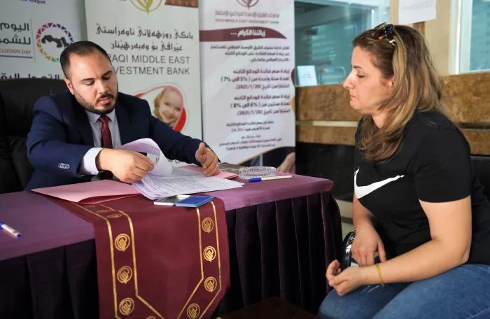 woman entrepreneur receiving loan from the bank