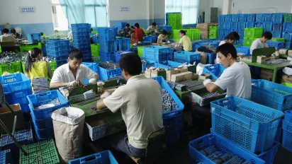 Workers in an umbrella manufacturer, China