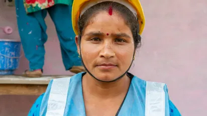 Woman wearing a worksite safety helmet