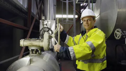 A worker in protective gear at a waste processing centre in Seynod, France.