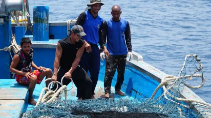 Cambodian migrant fishers on board a Thai flagged fishing vessel