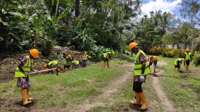 workers on a road rehabilitation project