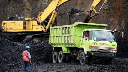 Heavy state of the art machinery is being used in the exploitation of the PT. Mulia Harapan Utama coal mine in East Kalimantan, Indonesia.