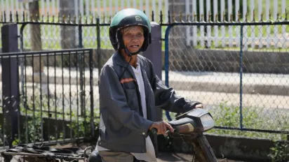 Elderly woman on a scooter