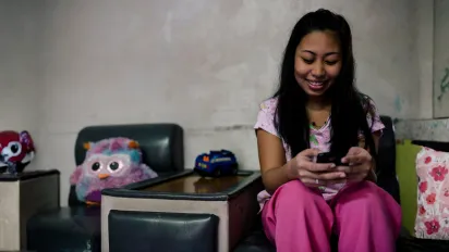 Mobile phones help domestic workers stay connected with friends and family.