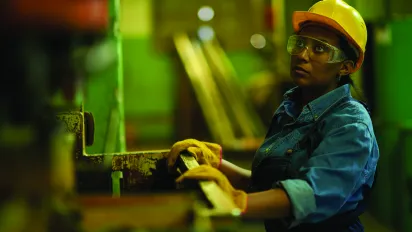 Young woman working at a construction site in Sri Lanka.May 19, 2015