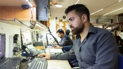 A young Syrian employee working as a technical service personnel in the IT sector, in Ankara, Turkey. He participated on the job training programme where he developed both his technical and social skills. 