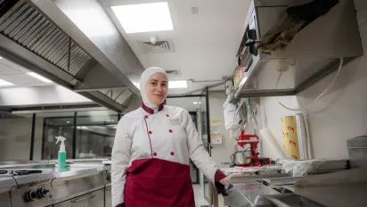 Culinary student Sara Al-Tamimi during her work-based learning placement in a restaurant kitchen. Amman, Jordan, September 15, 2025. 