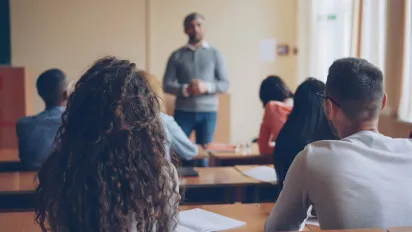 Teachers teaching in front of class