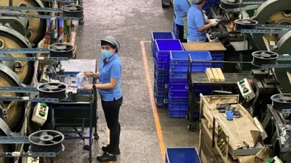 A worker in a Thai company producing components for the automotive industry 