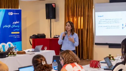 Ahlem Amri of the ILO speaks to journalists during a workshop on sustainable tourism in Monastir, Tunisia.