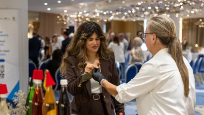 Visitors of the ENABLE entrepreneurship event, engage with a participating entrepreneur and explore locally produced items showcased during the exhibition. Beirut, Lebanon 22 September 2026