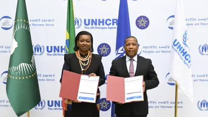 Officials holding signed documents
