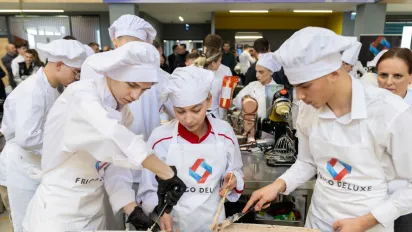 Students are preparing a dish together. 