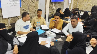 Participants discussing the Business Plans of their own projects during the entrepreneurship initiative, by the ILO in collaboration with the Chamber of Commerce and Industry in Taiz Governorate in Southwestern Yemen. 6/9/26