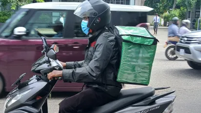 A delivery driver on the streets of Colombo.