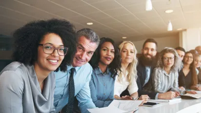 A group of diverse colleagues working together in an office