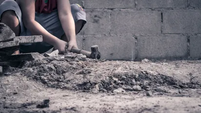 Young boy working in construction
