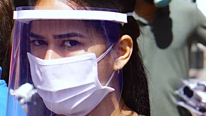 Girl in mask to secure from COVID-19