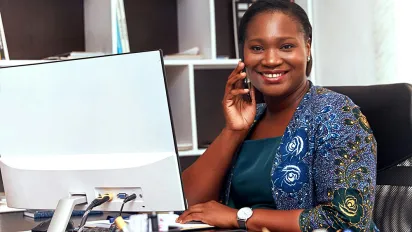 Business woman on phone in office