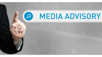 Man in a suit points a finger at a search box. The word Media Advisory is in the search