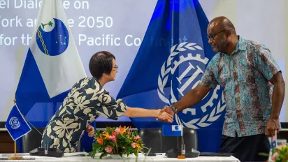 Chihoko Asada-Miyakawa, ILO Assistant Director-General and Regional Director for Asia and the Pacific and Esala Nayasi, Acting Secretary General of the Pacific Islands Forum Secretariat celebrate the signing