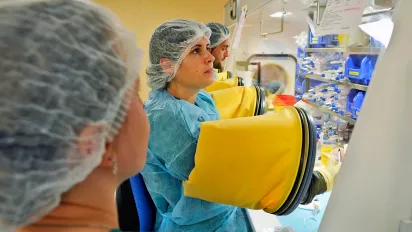 Nurse preparing medication in a sterile environment.
